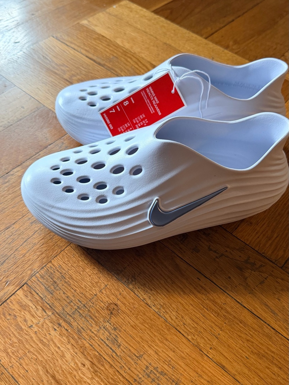Nike Kids White Slip-On Foam Sandal with Silver Swoosh